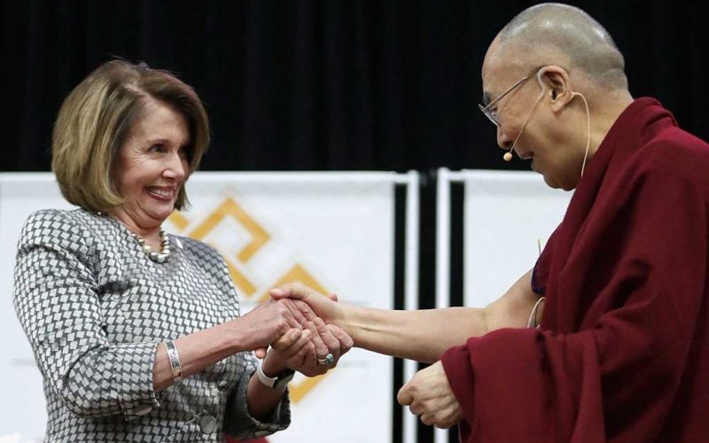 The Dalai Lama and Democrat Nancy Pelosi, Speaker of the US House of Representatives greet one another.